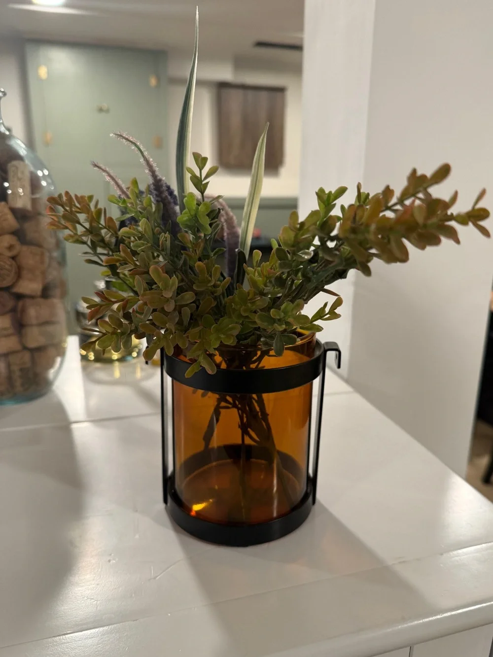 Amber Glass and Black Metal Accent Vase with Greenery
